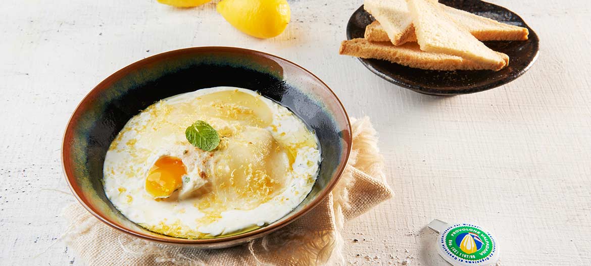 Eggs in cocotte with mild Provolone Valpadana, mint and lemon