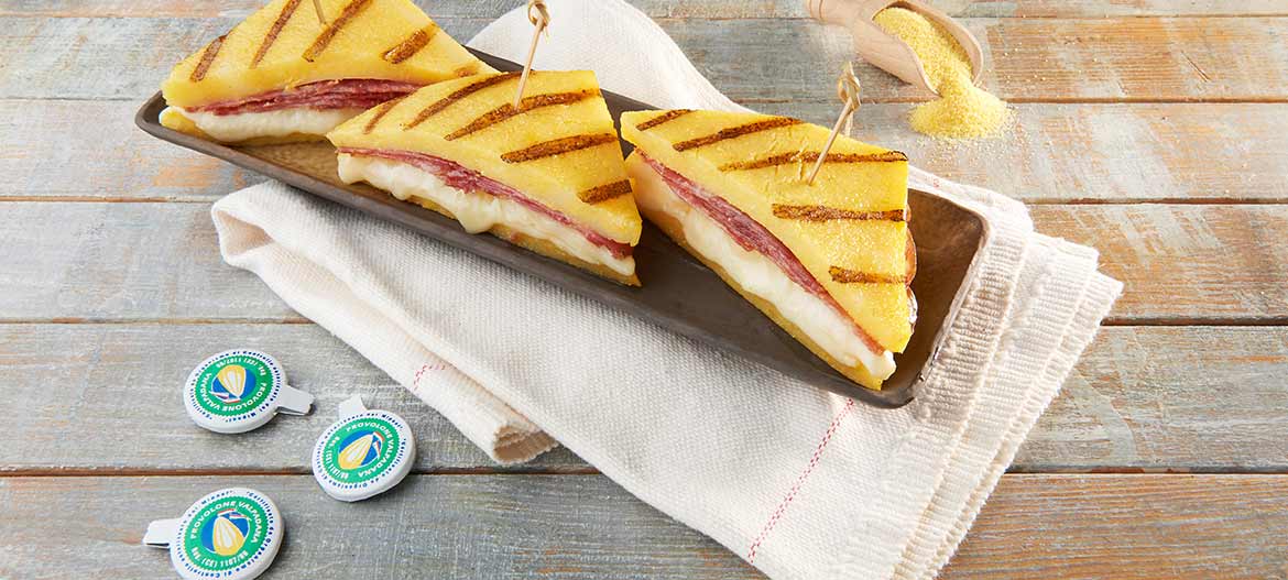 Grilled polenta sandwiches with mild Provolone Valpadana P.D.O. and Salame Cremona PGI