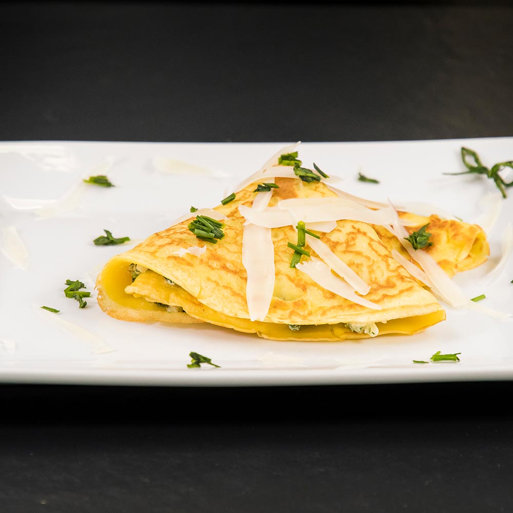 Crepes ricotta e spinaci con fonduta di Provolone Valpadana DOP dolce